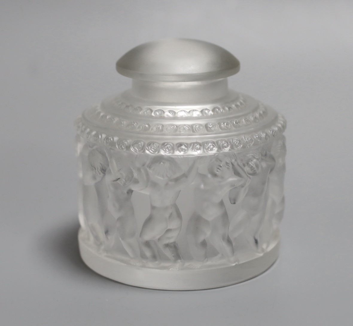 A Lalique Les Enfants pattern glass jar and cover. 30cm tall